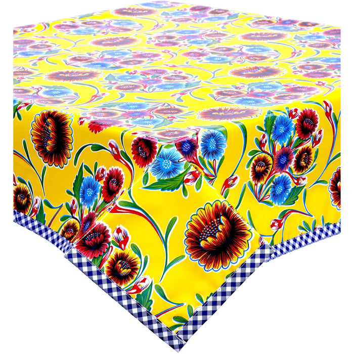 freckled sage bloom yellow oilcloth tablecloth with navy blue gingham trim
