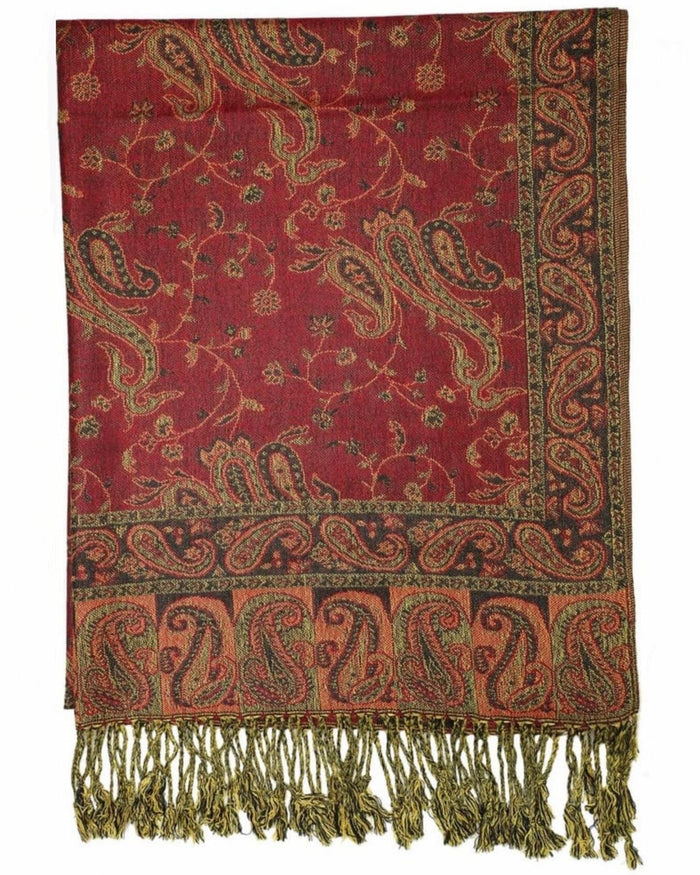 A reversible pashmina scarf with a paisley pattern in burgundy and gold colors, with fringes on the ends.