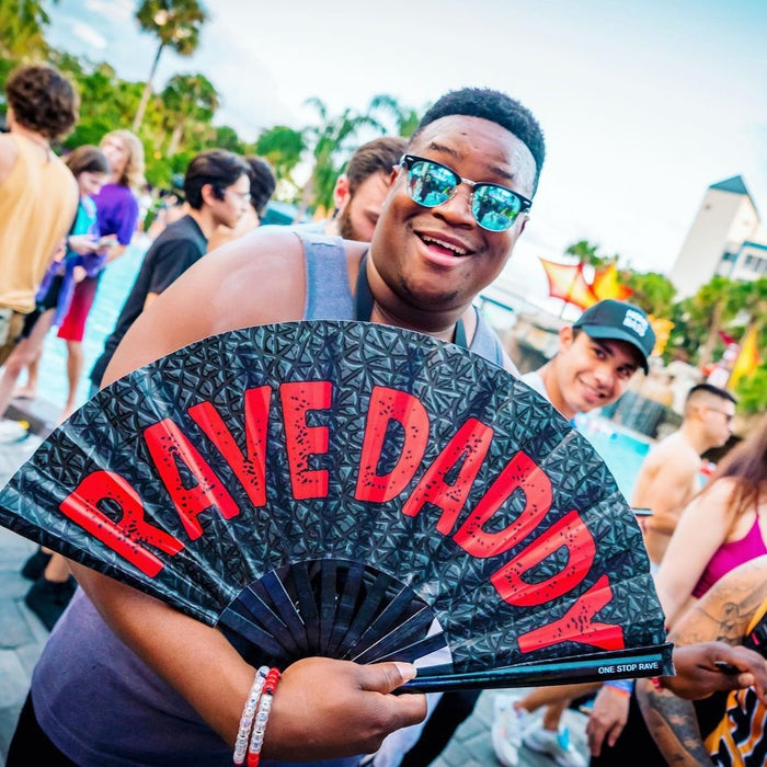 Rave Daddy hand fan held at festival lifestyle photo