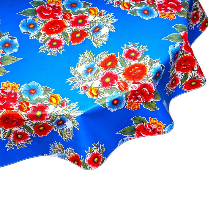 freckled sage round flowers on blue oilcloth tablecloth