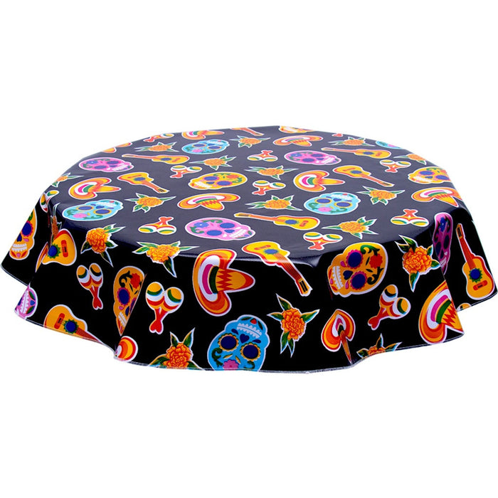 freckled sage round skulls on black oilcloth tablecloth