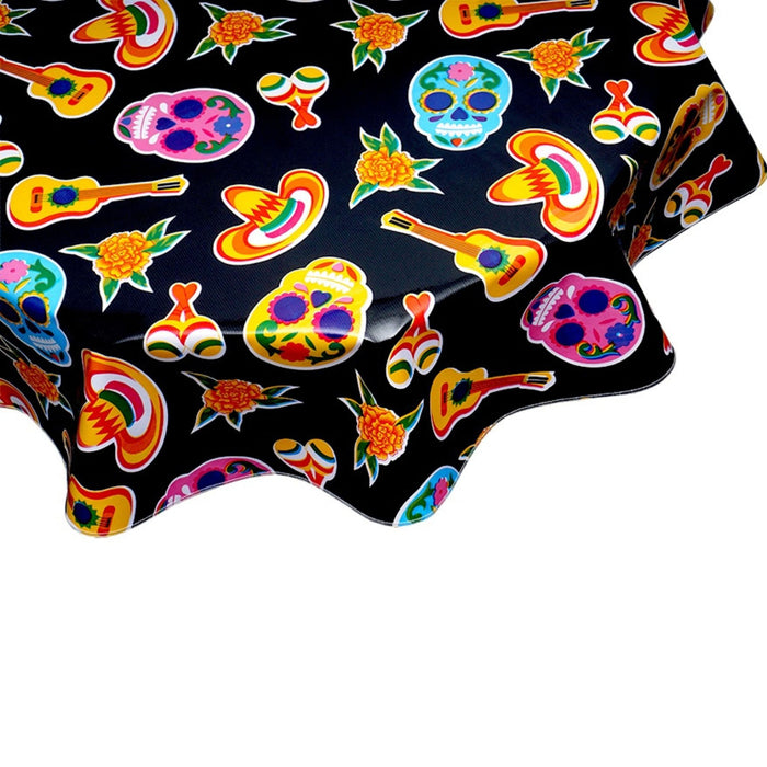 freckled sage round skulls on black oilcloth tablecloth