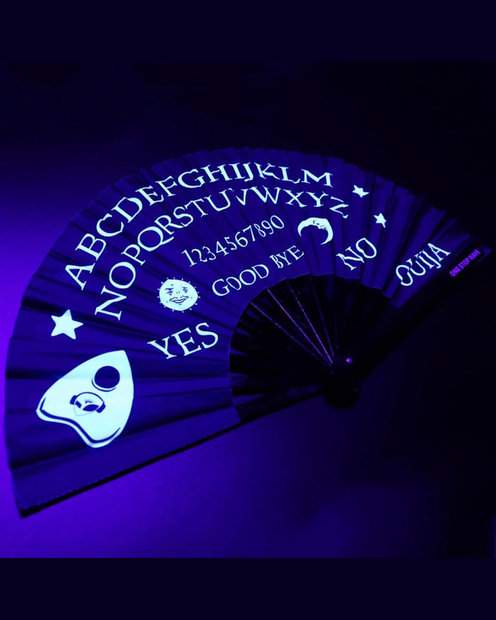 Wake the Dead hand fan angled view Ouija board detail under blacklight